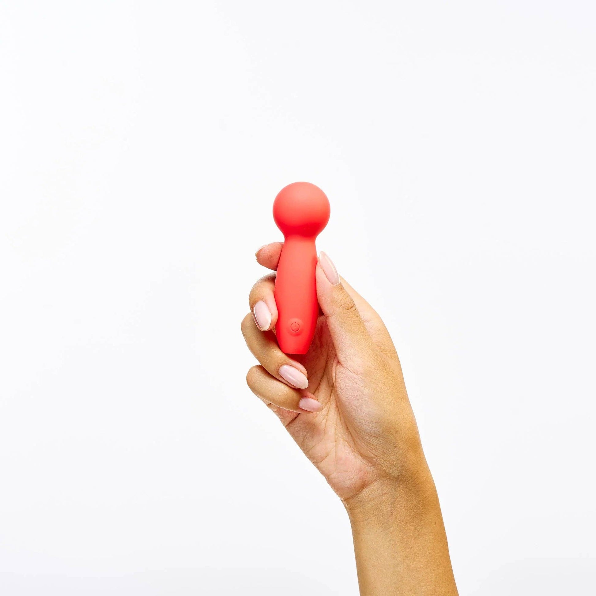 Small orange silicone mini wand vibrator with rounded tip and compact shape.