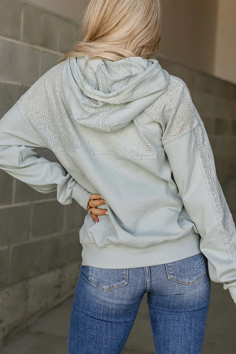 Back view of the Ampersand Avenue University Hoodie in Wonderstruck Blue featuring floral lace appliqué across the shoulders and hood.