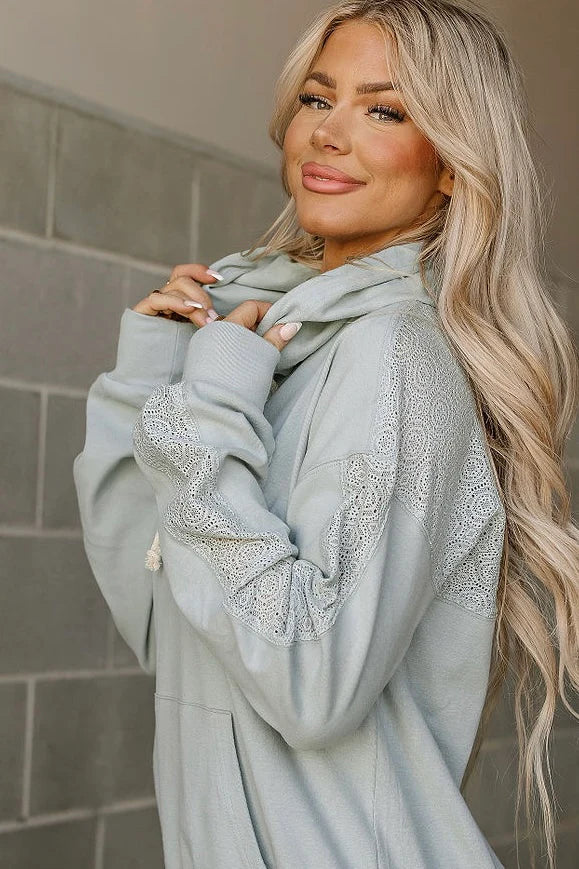 The Ampersand Avenue University Hoodie in Wonderstruck Blue with drawstring hood, kangaroo pocket, and floral lace sleeve accents.