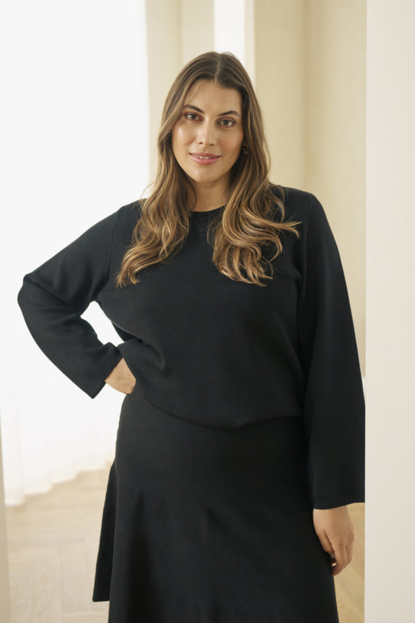Black flared knit skirt by Kaffe Curve styled with boots and Kaffe Curve Melina Knit Pull Over
