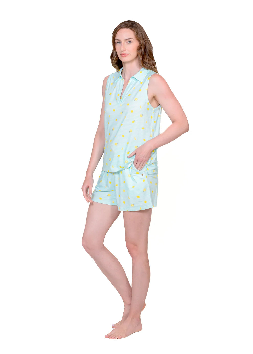 Woman wearing a light blue sleeveless top and shorts set with yellow pattern on a white background