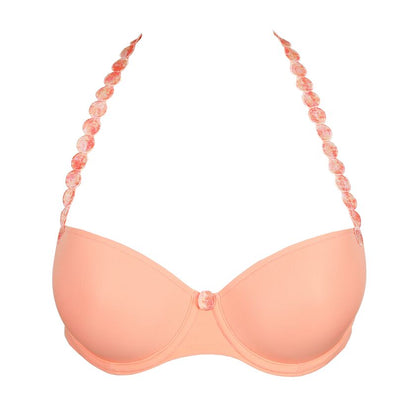 Peach-colored bikini top with beaded straps on a white background