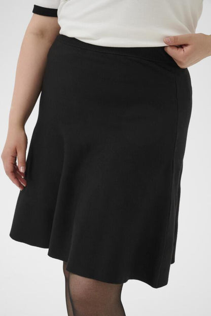 Closeup biew of Kaffe Curve Melina Skirt in Black on a white background.