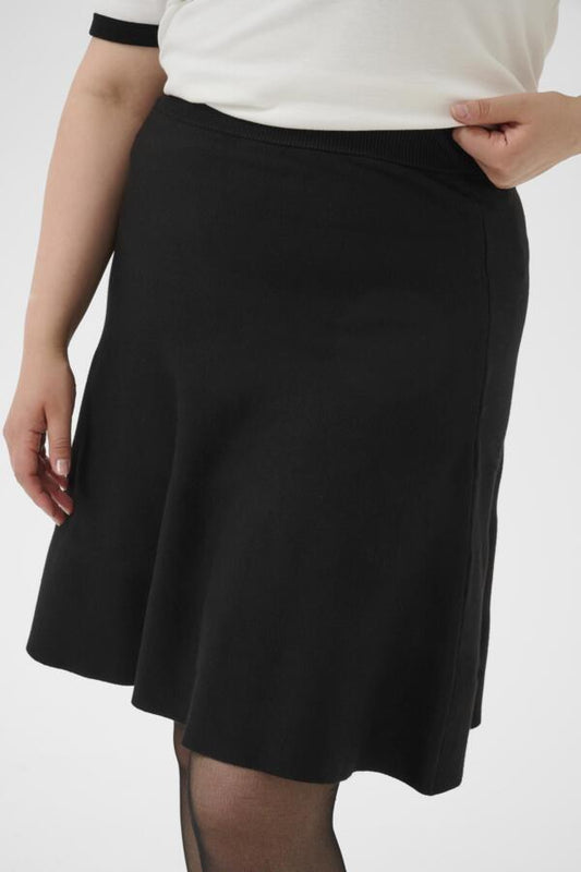 Closeup biew of Kaffe Curve Melina Skirt in Black on a white background.