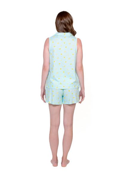 Back view of the sleeveless polo and short set on model
